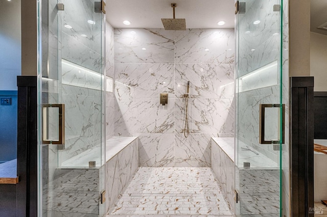 bathroom with a marble finish shower and recessed lighting