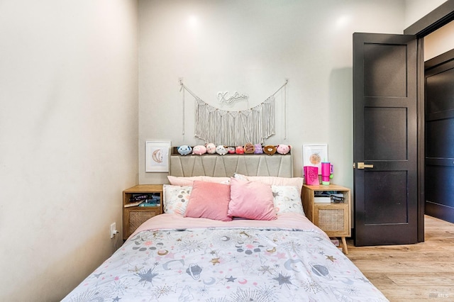 bedroom featuring light wood-style flooring