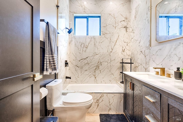 bathroom with toilet, a combined bath / shower with marble appearance, and vanity