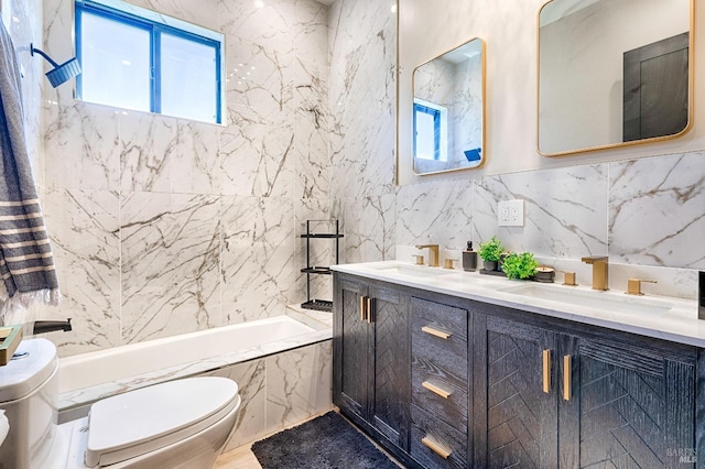 bathroom featuring a combined bath / shower with marble appearance, a sink, tile walls, decorative backsplash, and double vanity