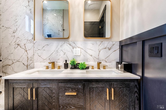 bathroom featuring double vanity and a sink