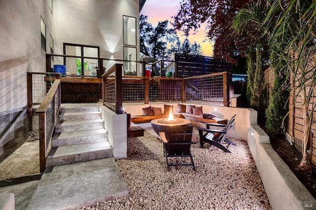 patio terrace at dusk with an outdoor fire pit