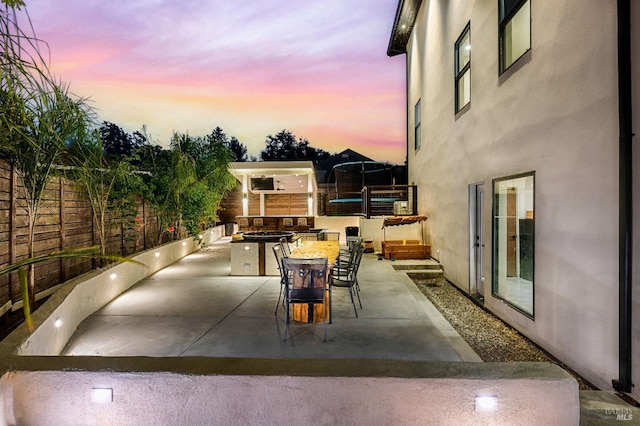 view of patio featuring a fenced backyard and outdoor dining area