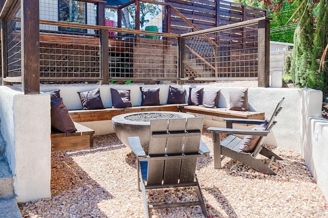 view of patio featuring an outdoor fire pit