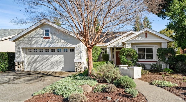 view of front of property with concrete driveway and an attached garage