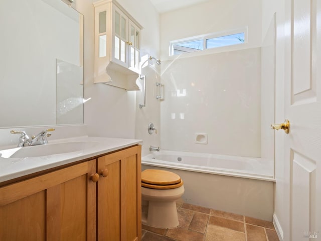 bathroom featuring tub / shower combination, vanity, and toilet