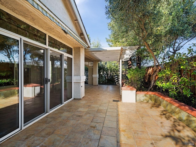 view of patio featuring fence