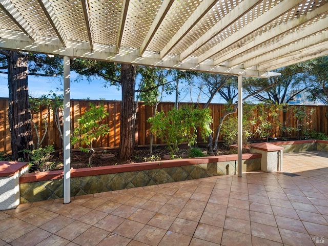 view of patio / terrace featuring a fenced backyard and a pergola