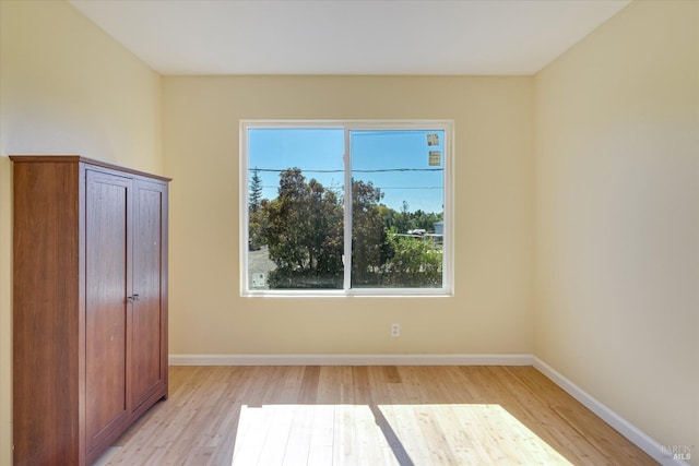 unfurnished bedroom with light wood-style floors and baseboards