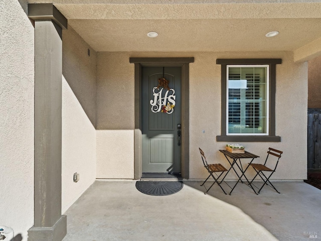 doorway to property with stucco siding