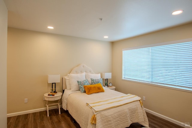 bedroom with dark wood-style floors, recessed lighting, and baseboards