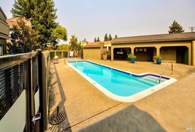 community pool featuring a patio area