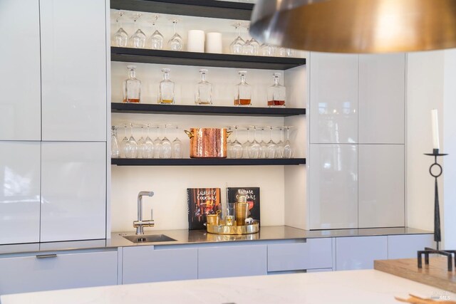 bar featuring a sink and indoor wet bar