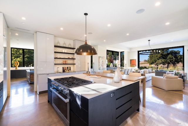 kitchen featuring high end range, modern cabinets, open shelves, white cabinetry, and plenty of natural light