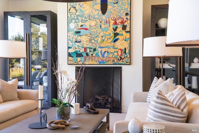 living area featuring a fireplace
