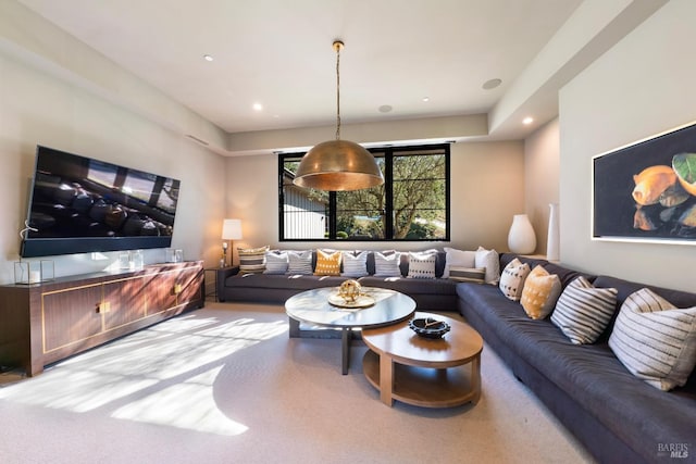 carpeted living area featuring recessed lighting