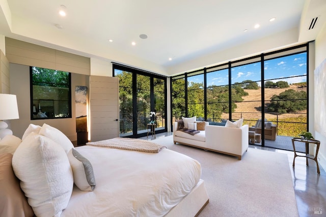 bedroom featuring visible vents, access to exterior, recessed lighting, and finished concrete flooring