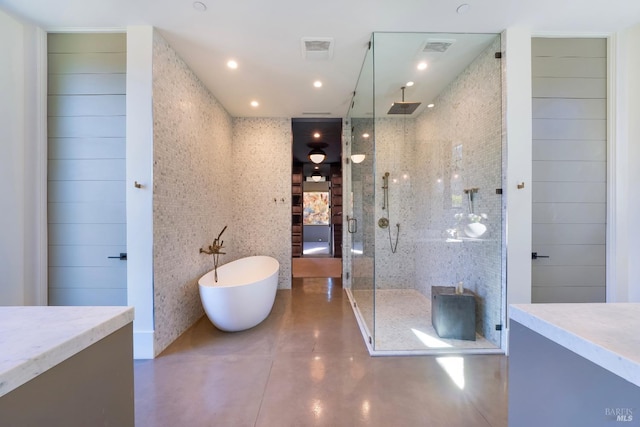 full bath featuring vanity, a stall shower, a soaking tub, recessed lighting, and visible vents