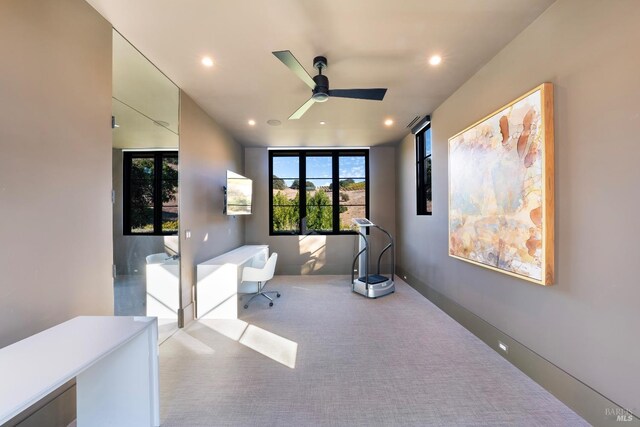 interior space with carpet floors, baseboards, a ceiling fan, and recessed lighting