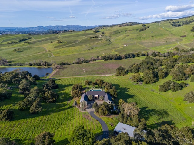 aerial view with a rural view and a water view