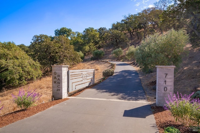 view of gate with fence