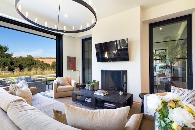 living area featuring a fireplace and plenty of natural light