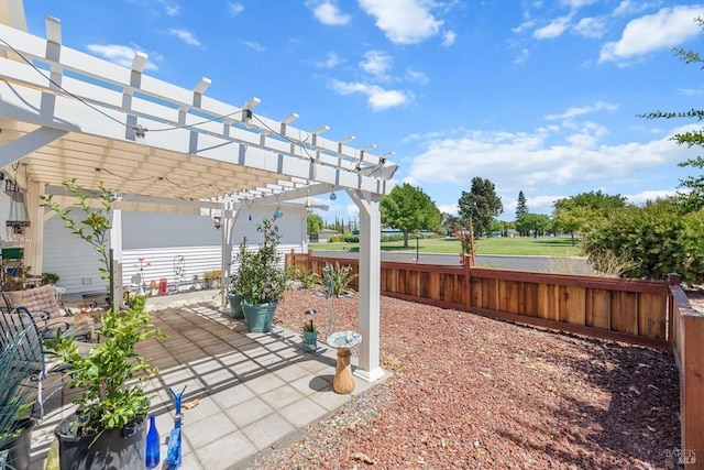 view of patio / terrace featuring fence and a pergola