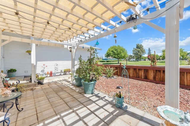 view of patio featuring fence and a pergola