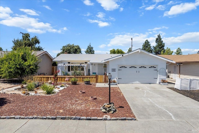 single story home with a garage and concrete driveway