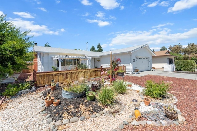 ranch-style home with a garage, a pergola, and concrete driveway