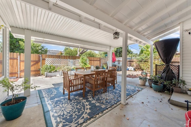 view of patio / terrace with outdoor dining area and fence