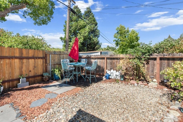 view of yard featuring a patio area and a fenced backyard