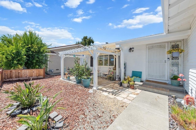 exterior space with a patio, fence, and a pergola