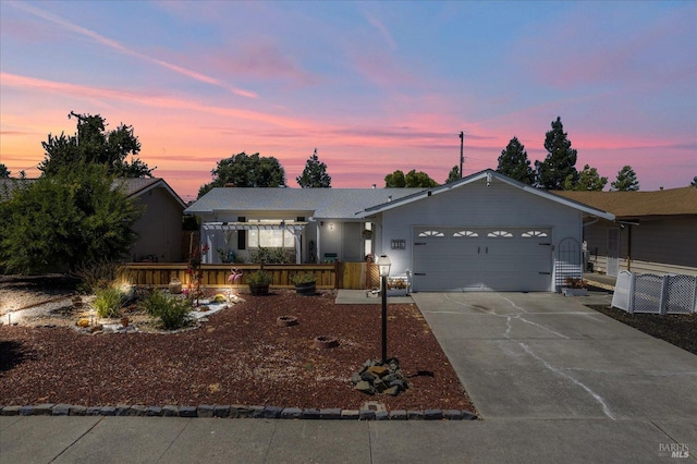 single story home featuring driveway and an attached garage