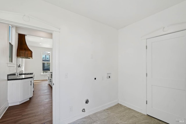 laundry area featuring hookup for a washing machine, hookup for a gas dryer, hookup for an electric dryer, and baseboards