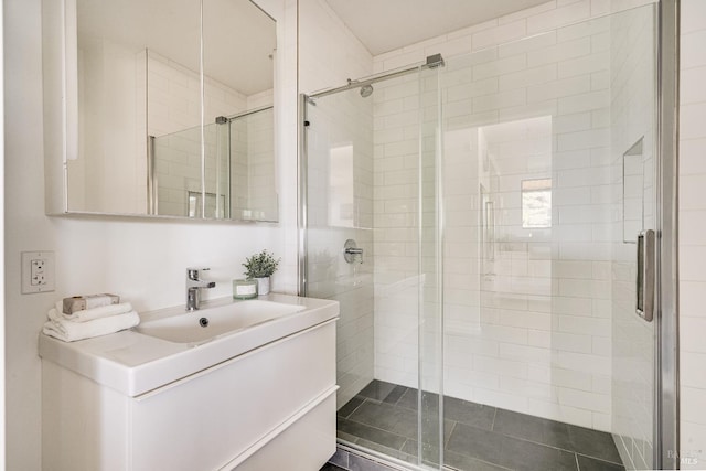 bathroom with a stall shower and vanity