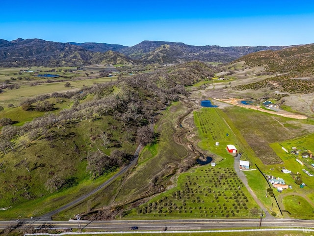 birds eye view of property with a rural view and a mountain view