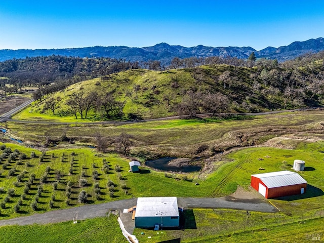 aerial view featuring a rural view and a mountain view