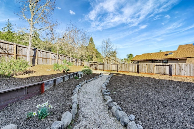 view of yard featuring a fenced backyard