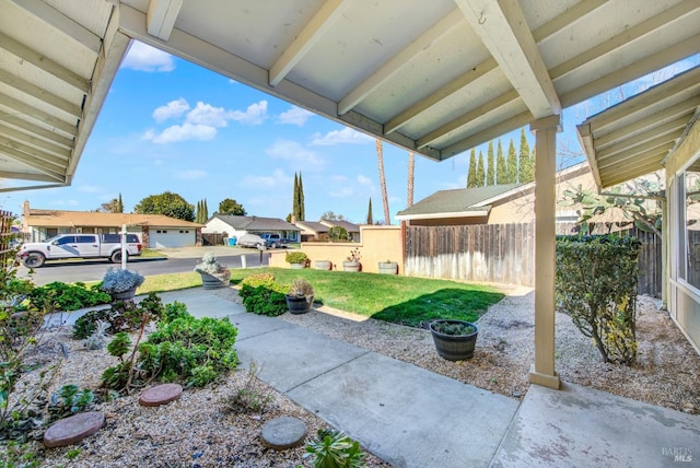 view of patio / terrace featuring fence