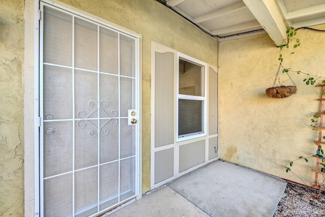 exterior space with stucco siding