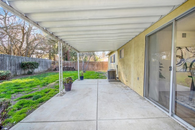 view of patio / terrace with a fenced backyard and cooling unit