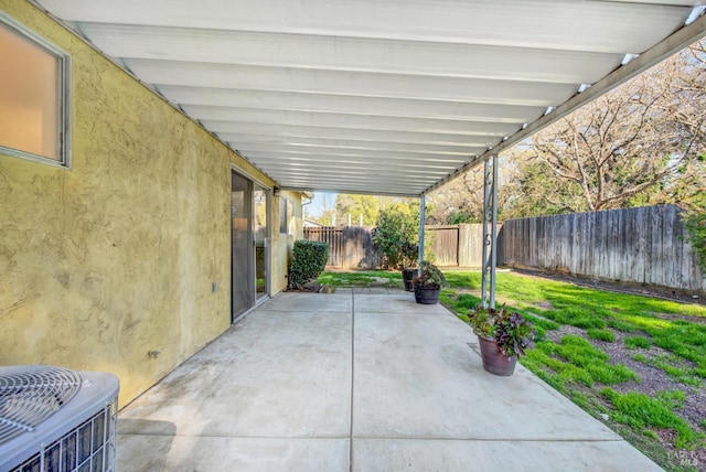 view of patio / terrace featuring a fenced backyard and central air condition unit