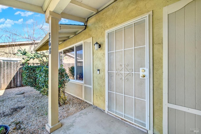 property entrance with fence