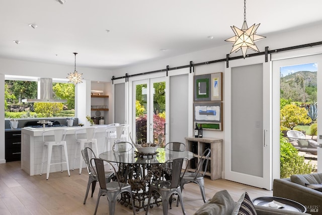 100 W Trinity Rd, Glen Ellen, CA 95442 - dining area with a barn door and light wood-type flooring