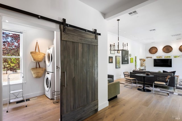 100 W Trinity Rd, Glen Ellen, CA 95442 - living area featuring stacked washer / dryer, a barn door, baseboards, and light wood-style floors