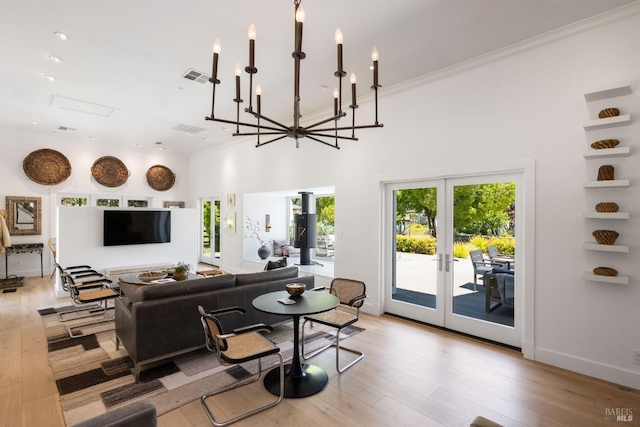 100 W Trinity Rd, Glen Ellen, CA 95442 - living room featuring hardwood / wood-style flooring, french doors, a chandelier, ornamental molding, and baseboards