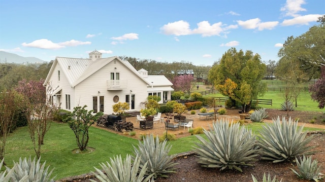 100 W Trinity Rd, Glen Ellen, CA 95442 - rear view of house featuring a patio, an outdoor fire pit, metal roof, and french doors