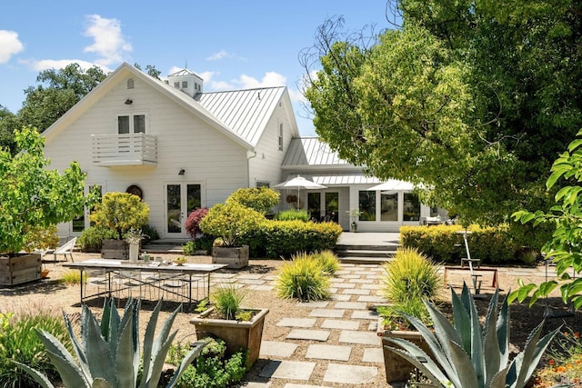 100 W Trinity Rd, Glen Ellen, CA 95442 - rear view of property with french doors, a patio, metal roof, and a standing seam roof
