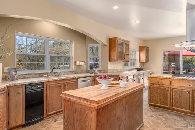 kitchen featuring island range hood, stainless steel appliances, butcher block countertops, a kitchen island, and a sink